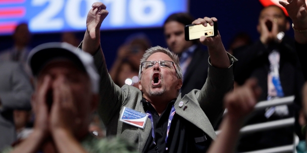 Members of the crowd in the Cleveland arena react badly to Senator Ted Cruz's failure to endorse Donald Trump. Photo / AP