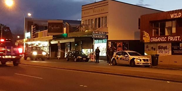 Police outside the Cameron Rd dairy which was robbed at 5.26pm this evening.