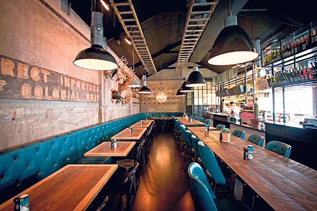 New Plymouth's Social Kitchen which features deer heads and sculptures of hands protruding from the wall.
