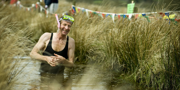 A man taking part in the World Bog Snorkelling Championship in Wales. Photo / Flickr, Visit Britain