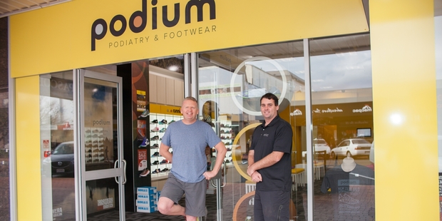 Tarawera Ultramarathon organiser Paul Charteris and owner Matt Fraser outside Podium's new Rotorua store. Photo / Kylie Day Photography