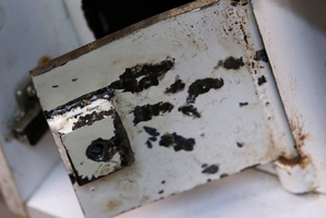 The door to the safe was left buckled after thieves broke in and stole cash.