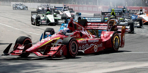Scott Dixon leads the pack as drivers take the first corner at the IndyCar Toronto. Photo / AP