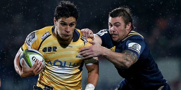 Matt Toomua of the Brumbies and Liam Squire of the Highlanders. Photo / Getty