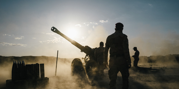 Iraqi soldiers fire artillery towards Islamic State positions from a location outside Makhmour, Iraq. Photo / Washington Post