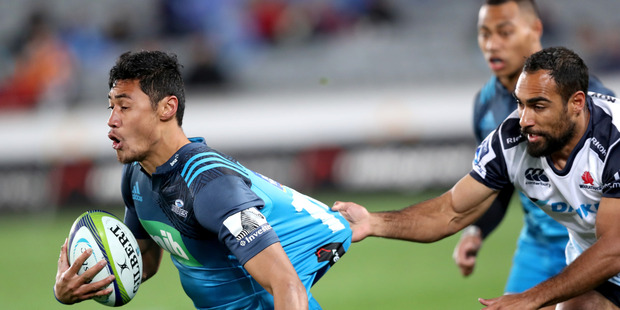 Melani Nanai of the Blues is tackled by Reece Robinson of the Waratahs during the round 17 Super Rugby match between the Blues and the Waratahs at Eden Park. Photo / Getty Images