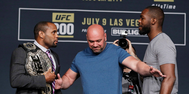 Dana White, center, stands between Daniel Cormier, left, and Jon Jones during a UFC 200 mixed martial arts news conference. Photo / AP.