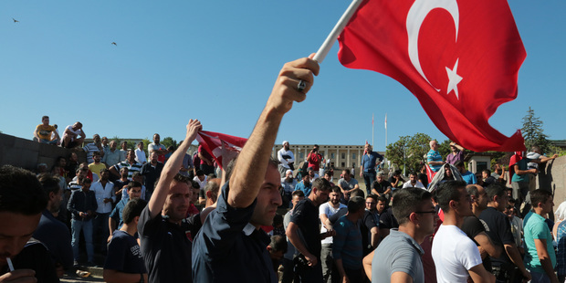 Turks protest against the attempted coup outside Parliament in Ankara, Turkey. Photo / AP