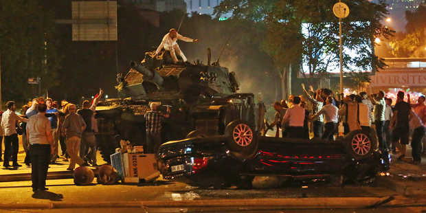Tanks move into position as Turkish people attempt to stop them in Ankara, Turkey. Photo / AP