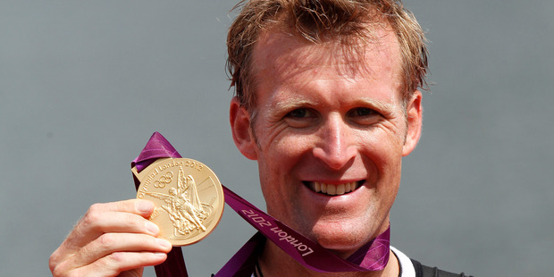 Golden glow: Mahe Drysdale on the podium after being crowned Olympic champion at the 2012 Games in London. Photo / Mark Mitchell