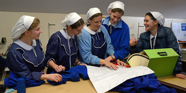 Women work on schedule for concert. Photo / Supplied