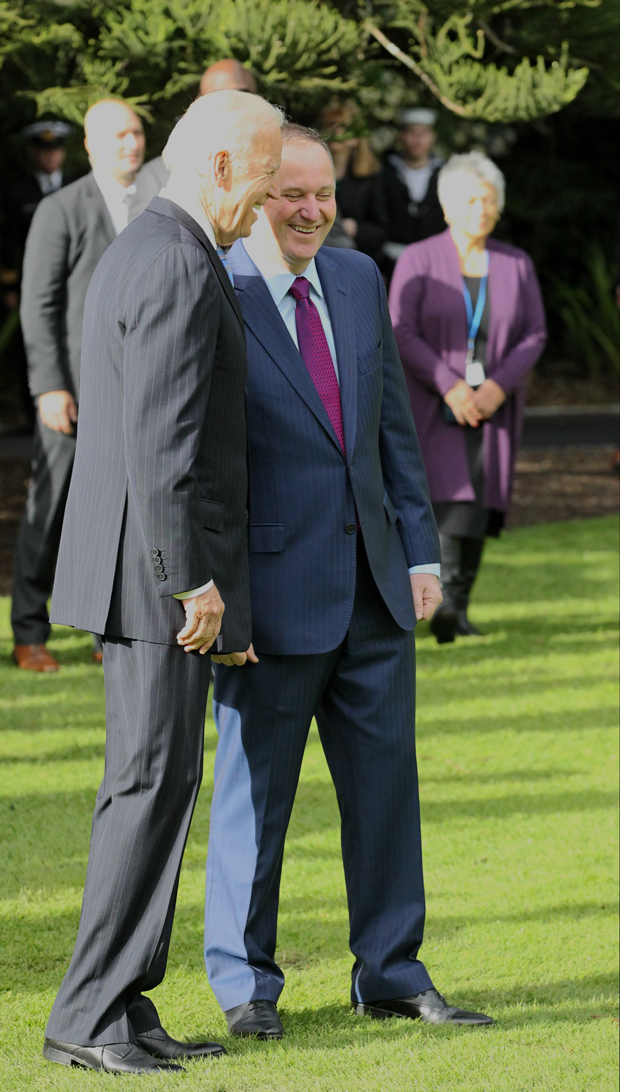 US Vice-President Joe Biden and the New Zealand Prime Minister John Key greet each other at Government House. Photo / Greg Bowker