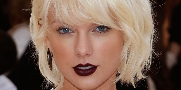 Update the status! Kim, Kanye and Taylor are feuding! Again! Photo / AP
