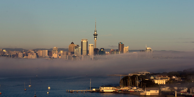 Early morning fog, Sky Tower and Auckland CBD skyline, on Thursday morning. 08 August 2013 New Zealand Herald photograph by Brett Phibbs