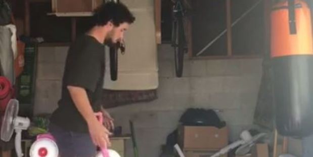 Funny Kiwi dad Jordan Watson shows us how to tidy a mancave. Photo: How to DAD/Facebook