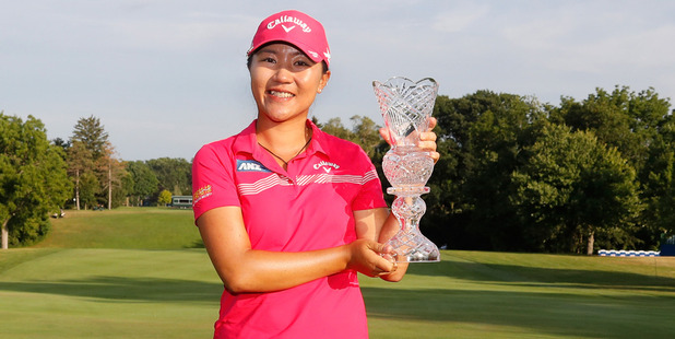 Lydia Ko of New Zealand holds up the championship trophy after winning the Marathon Classic. Photo / Getty