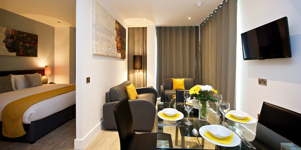The apartment's decor was simple and contemporary, with a bee motif running throughout. Photo / Supplied