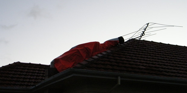 The Te Awamutu family's chimney was destroyed, breaking tiles on the roof. Photo / Supplied