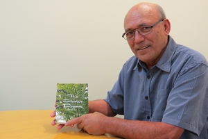 Darryl Russell with a copy of the book he has written and published that will be launched in Waipukurau next week.