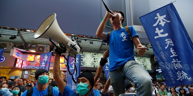 Edward Leung of Hong Kong Indigenous shouts slogans with his supporters during a demonstration in Hong Kong. Picture / AP