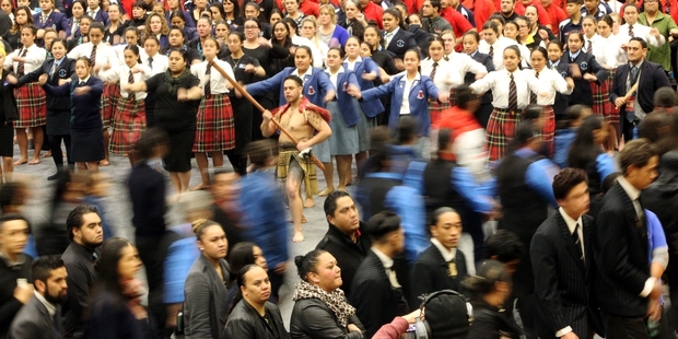 Napier schools Hukarere (tartan skirts) and St Joseph's Maori Girls (blue blazers) aren't in the competitions but stepped proudly to the front, waewae whakamua, during the powhiri, waiata and haka. Photo / Paul Taylor