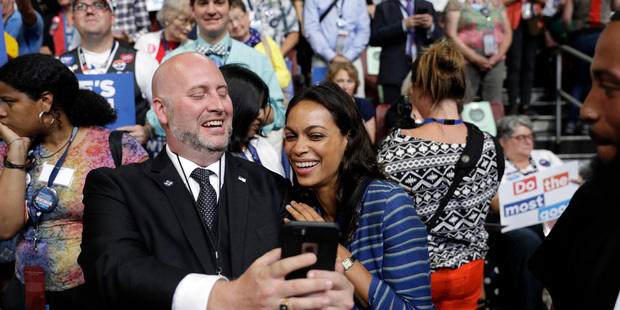 Actress Rosario Dawson takes selfie with a delegate on the convention floor. Photo / AP