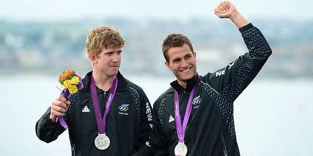 Peter Burling and Blair Tuke celebrate on the podium after winning silver in the 49er sailing class at the London 2012 Olympic Games. Photo / Getty Images