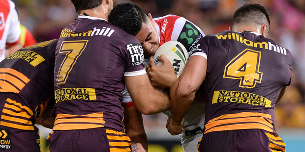 Tim Lafai of the Dragons takes on the Broncos defence. Photo / Getty Images.