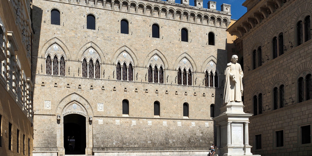 View of the main facade of Monte dei Paschi di Siena, the oldest bank in the world, founded in 1472 as a mount of piety (ancient pawnshop).