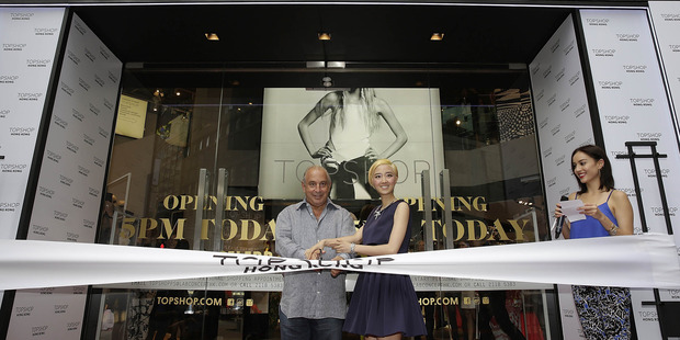 Sir Philip Green the owner of Topshop and Taiwanese actress Gwei Lun Mei cut a ribbon to mark the opening of the new Topshop store in Hong Kong. Photo / Getty