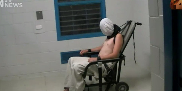 Still image of 17-year-old Dylan Voller, restrained and fitted with a spit hood inside the Youth Detention Centre in Alice Springs. Photo / ABC/Four Corners