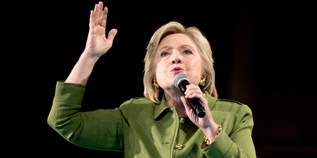 Democratic Presidential candidate Hillary Clinton remains largely unpopular and angry white men won't be able to handle a woman in power, Moore warns. Photo / AP