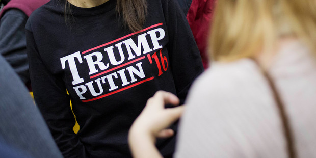 A woman wears a shirt reading 'Trump Putin '16' while waiting for Republican presidential candidate Donald Trump to speak. Photo / AP