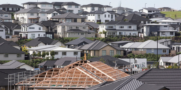 Infometrics predicts a national decline in house prices of 14 per cent in real terms by mid-2020. Photo / Greg Bowker