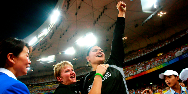 Adams and her coach Kirstin Hellier are elated as her shot put victory is sealed at Beijing's National Stadium on day eight of the 2008 Games. Photo / Kenny Rodger