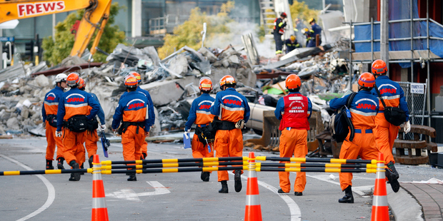 Members of the Disaster Relief Team from Japan move in to the site of the CTV building in central Christchurch. Photo / Sarah Ivey