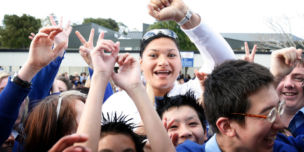 Adams is mobbed by students at Macleans College in Bucklands Beach after her victory in Beijing. Photo / Greg Bowker