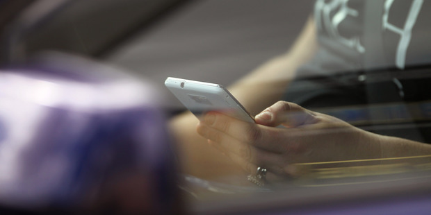Driver distractions, particularly those posed by talking, texting and checking emails on a mobile phone while driving, are being targetted during Operation Habit. Photo / Duncan Brown
