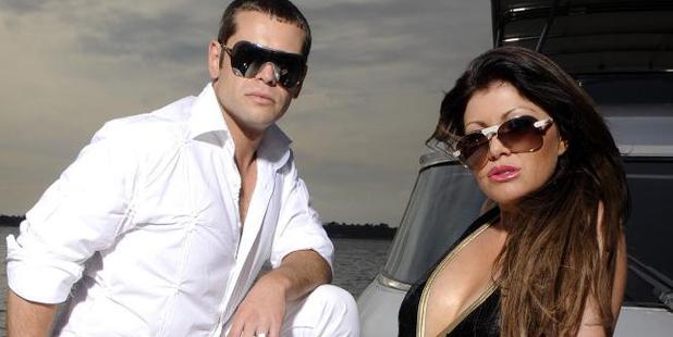 Zhenya and Lydia Tsvetnenko posing on a friend's boat. Photo / News Limited