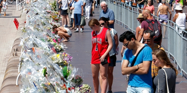 The massacre of innocents by an assailant in an 18-tonne truck could easily have been an excuse for a draconian crackdown on foreigners. Photo / AP