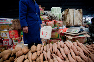 Sweet potatoes on sale at a Beijing market. Photo / Bloomberg