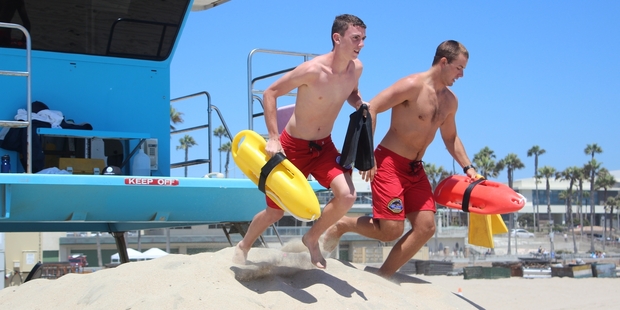 New Zealand lifeguard Corey Davies, 15, (left) patrols with an American lifeguard at Huntington Beach, California, during the exchange programme. Photo / Supplied