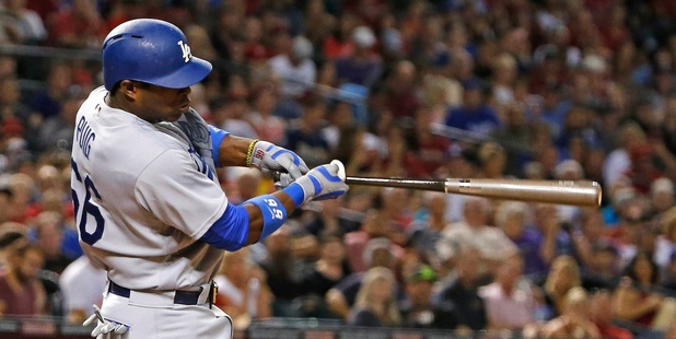 Los Angeles Dodgers' Yasiel Puig follows through on a two-run single. Photo / AP