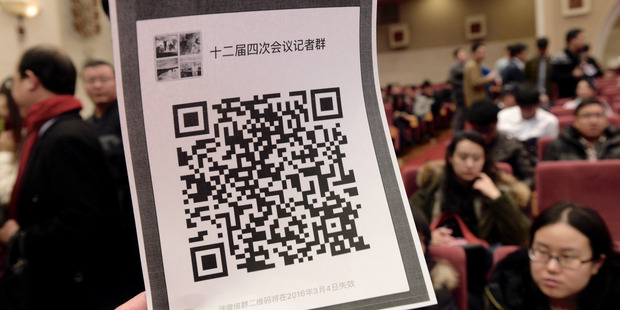 A picture shows the QR code for an organised WeChat group. Photo / Getty Images