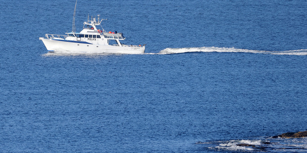 Police continue their search off the Tasmanian coast. Photo / Richard Jupe / The Mercury
