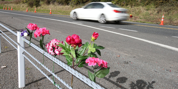 MEMORY: Tributes laid at the site of the crash. PHOTO/JOHN BORREN