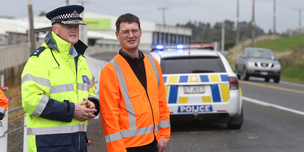National Road Policing Manager Superintendent Steve Greally with NZTA senior safety engineer Adam Francis at the crash site where five people were killed on Tuesday. PHOTO/JOHN BORREN