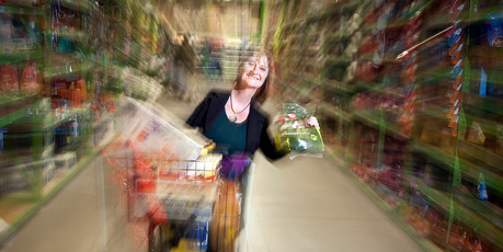 Occupational therapist Yvonne Hartnell of Shopmobility with a "mart cart" designed to make shopping easier for people with limited mobility.