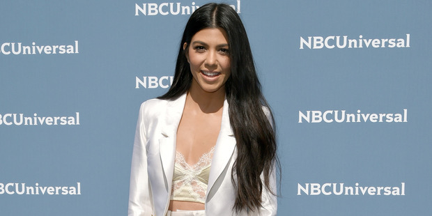 Kourtney Kardashian is pinning her hopes on a "water blessing" to help her find love. Photo / AP