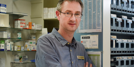 Smartmed pharmacy manager Peter Bremner with the robotic Mediroll dispensing machine. PHOTO/GEORGE NOVAK